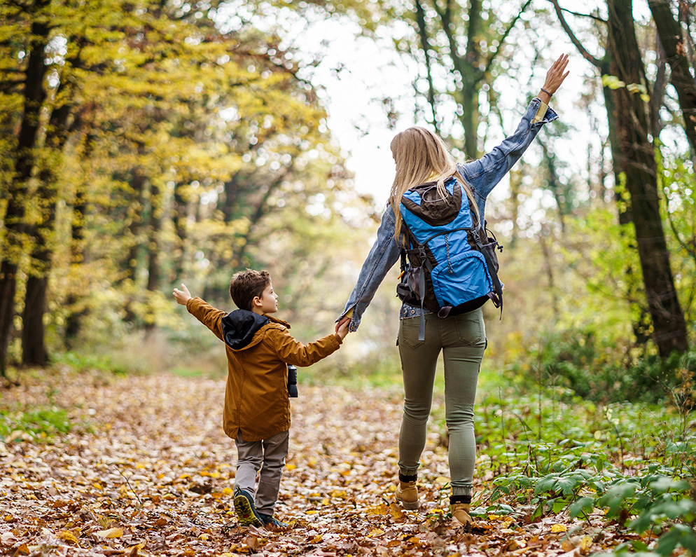 Mom and son going for a walk in the woods. Therapy for parents in Pacifica